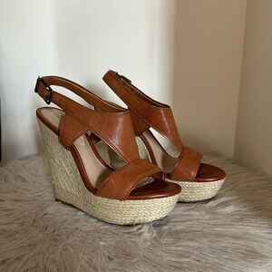 Hardly worn Gianni Bini wedges. Tan leather with neutral woven wedge heel.